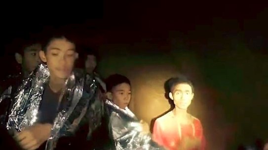 Adul Sam-on on right in a section of Tham Luang Cave.