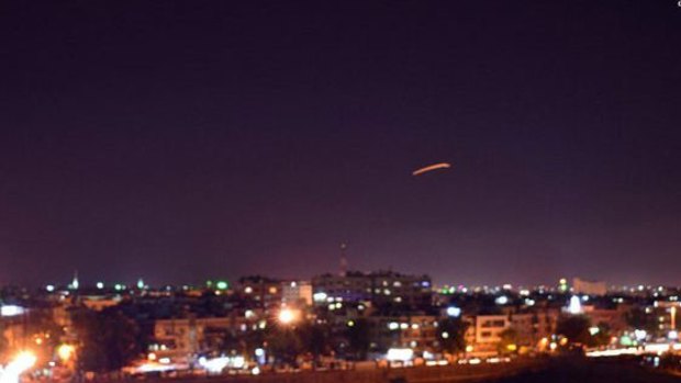 The Syrian state agency SANA released pictures of reported air defence systems intercepting missiles over Damascus on Saturday.