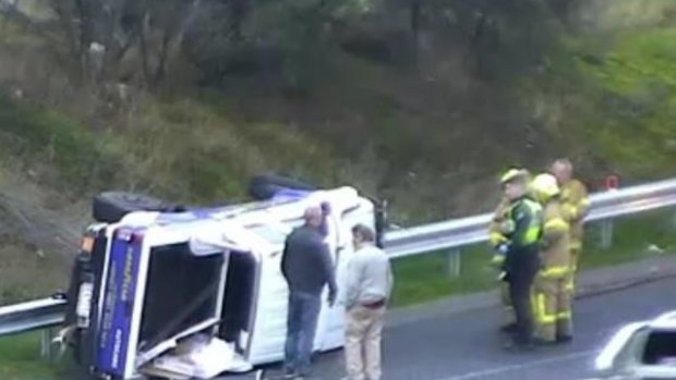 A ute rolled on the Calder Freeway on a wet and windy Thursday morning. 