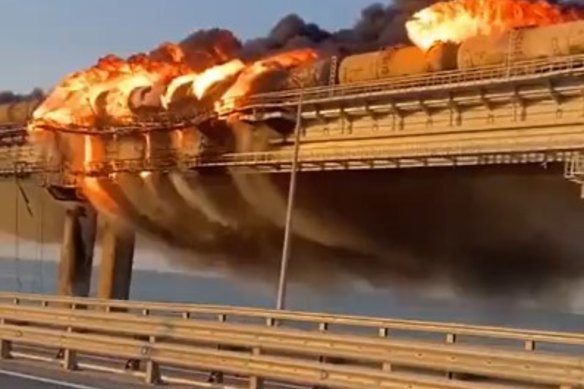 Flames and smoke rise from the bridge connecting the Russian mainland and Crimea.