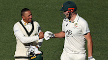ADELAIDE, AUSTRALIA - JANUARY 17: Usman Khawaja and Cameron Green of Australia walk from the field at stumps on Day 1 during the Mens Test match series between Australia and West Indies at Adelaide Oval on January 17, 2024 in Adelaide, Australia. (Photo by Paul Kane/Getty Images)