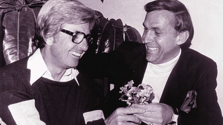 A failed reconciliation between Rogers and Laws, who presented with a posy of flowers in 1977.