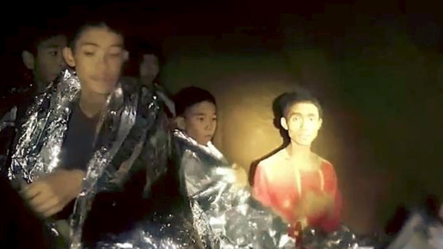 Adul Sam-on with other members of his team in a section of Tham Luang Cave.