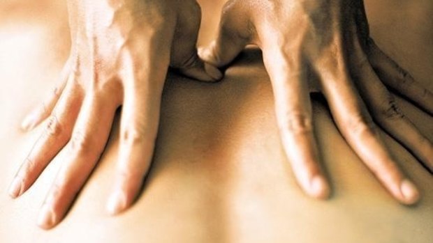 The massage parlour operator was penalised for not back-paying two of its employees.