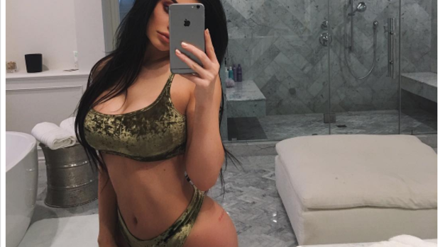 Kylie Jenner squeezed in one last bathroom selfie. 