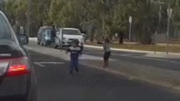 The children run onto the road.