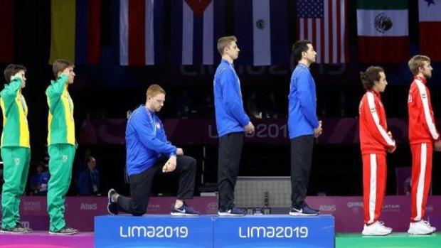 Statement: Race Imboden takes a knee during the national anthem and medal ceremony on Friday at the Pan American Games in Lima, Peru. 