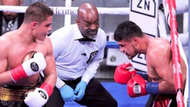Rising star: Bilal Akkawy has Victor Fonseca on the ropes at Madison Square Garden last year.