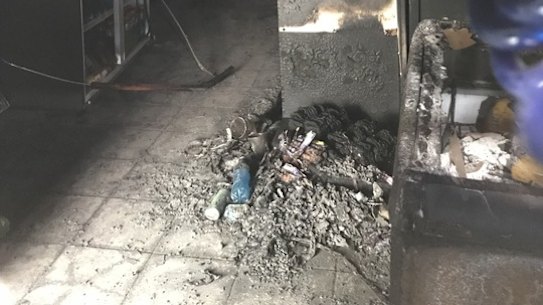 Inside the firebombed Fortitude Valley business. still smelling of burnt plastic on Friday afternoon.