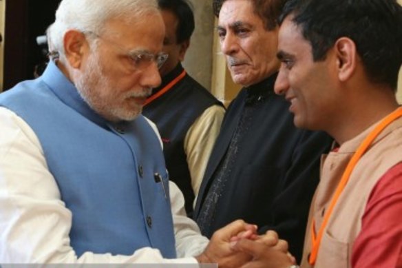 Balesh Dhankhar shakes hands with Indian Prime Minister Narendra Modi in Sydney in an image from Dhankhar’s now removed website.