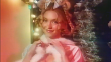 Sydney Sweeney dressed as Cindy Lou Who in a new holiday campaign for her lingerie brand Syrn.