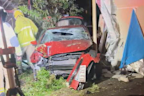 A red hatchback seen smashed into a home in Marsden, south of Brisbane.