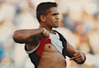Nicky Winmar bares his chest at opposition football fans in 1993 (Wayne Ludbey/The Age)