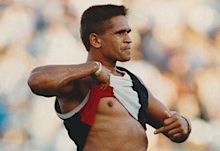 Nicky Winmar bares his chest at opposition football fans in 1993 (Wayne Ludbey/The Age)