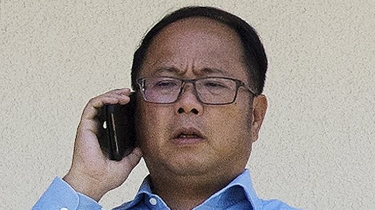 Huang Xiangmo on the balcony of his Mosman home before his permanent residency was cancelled in December.