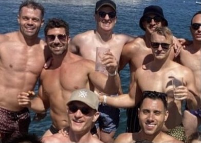 Party boy: Heston Russell, second from left, on Sydney Harbour earlier in the day on January 2.