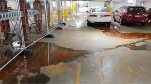Water continues to seep into the building's car park.
