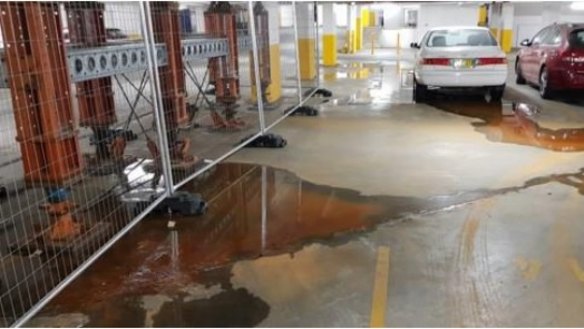 Water continues to seep into the building's car park.