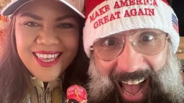 Coalition Senator Jacinta Nampijinpa Price poses in a MAGA cap with her husband Colin Lillie in this Yuletide snap taken from her social media page.