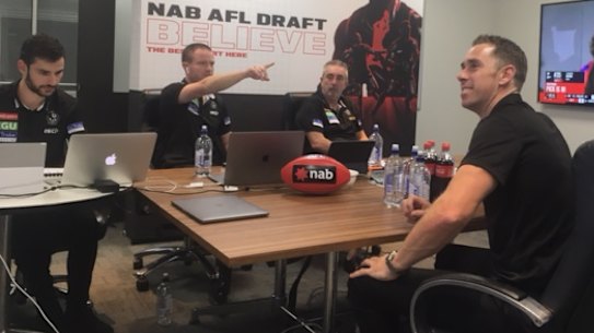 Inside view: Collingwood recruiters at the AFL draft on Wednesday night.