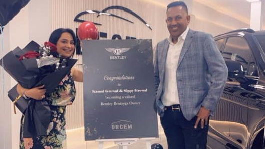 Sippy Grewal and wife Kamal stand alo<em></em>ngside their recently purchased Bentley.