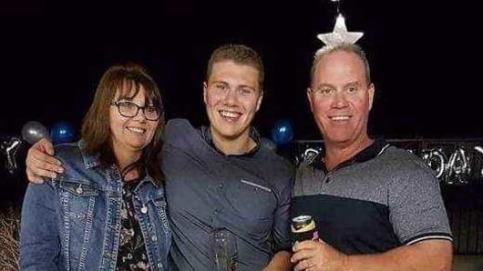Senior Constable David Masters with wife Sharon and son Jack.