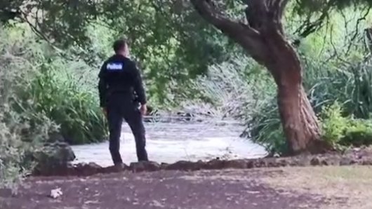 Police at the scene after the toddler was found unresponsive in a pond at Footscray Park. 