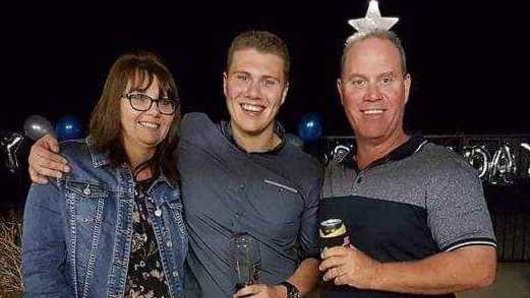 Senior Constable David Masters with wife Sharon and son Jack.