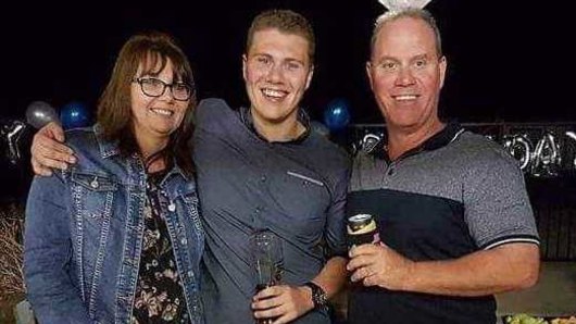 Senior Constable David Masters with wife Sharon and son Jack.