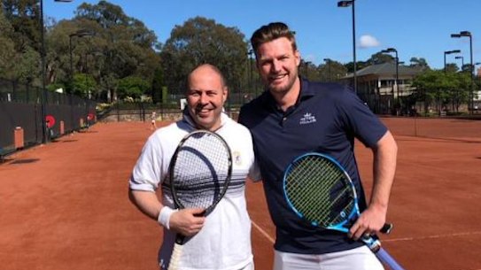 Federal Treasurer Josh Frydenberg poses with Sam Groth in October.