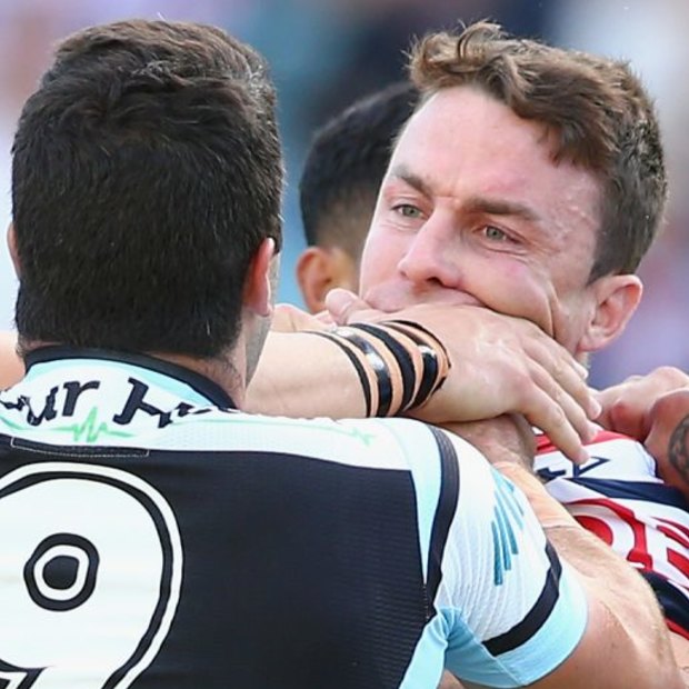 Cronulla’s Michael Ennis and Roosters’ James Maloney (both right) scuffle in 2015, one season before becoming Sharks teammates.