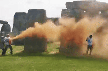 Climate protesters spray colour on Stonehenge.