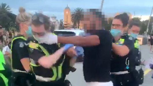 A man was arrested by police on the St Kilda beach foreshore on Saturday evening. 
