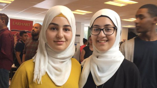 English students, Syrian refugees and sisters Ftoun and Amineh, from Oxford Spires Academy. Ftoun has won national fame in Britain with a poem remembering Damascus.
