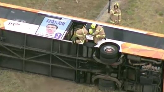 The bus tipped on its side. 