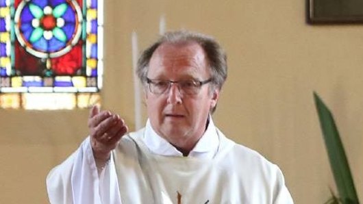 Wollongong priest Father Ron Peters has been charged over alleged historical indecent assaults in Sydney's west.