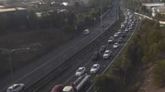 A traffic camera shows the northbound congestion on the Centenary Motorway in Darra about 7am.