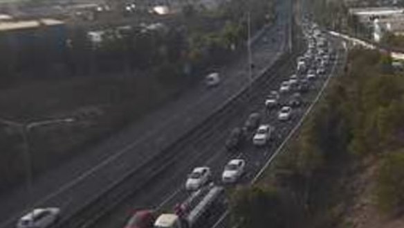A traffic camera shows the northbound congestion on the Centenary Motorway in Darra about 7am.