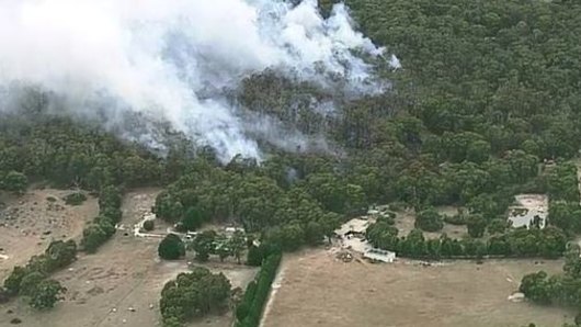 The fire is threatening homes in Benloch, north-west of Melbourne.