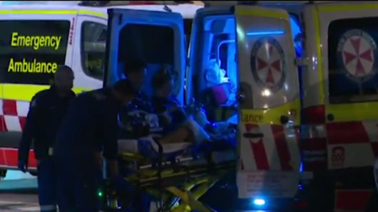 Jordan Byrne is treated by paramedics at the scene on Saturday night. 