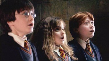 Harry, Hermione and Ron in the first Harry Potter film.