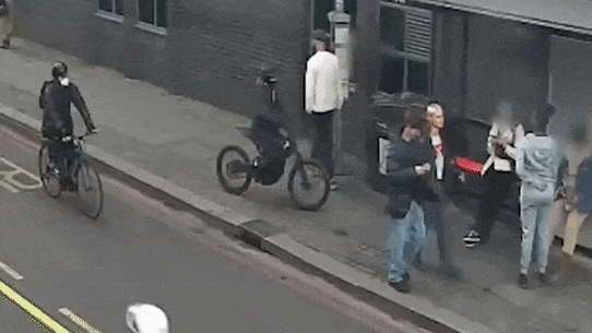 Mobile phone robbery at a London bus stop.
