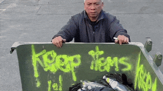 A collector returning cans and bottles for recycling in Sydney.