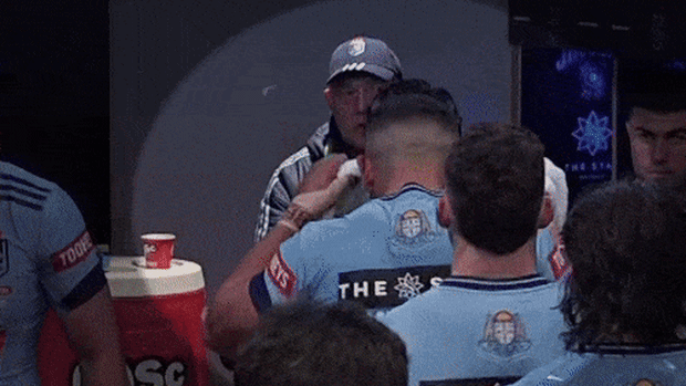 Origin players inhaling from buckets before the match.