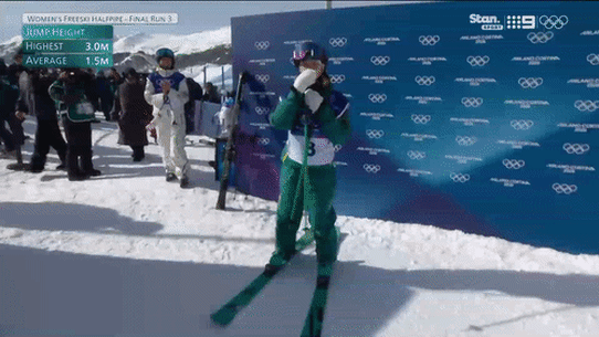 Eileen Gu and Indra Brown share a hug after the Australian’s final run in the women’s freeski halfpipe final.