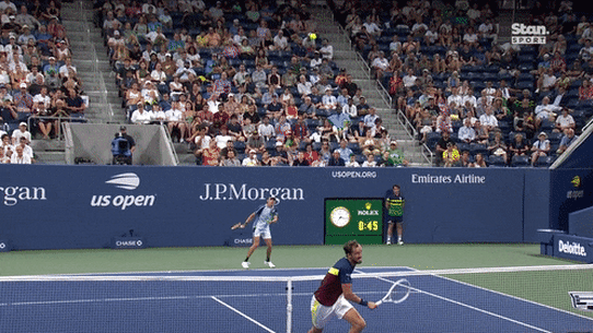 Daniil Medvedev fires off a tweener against Alex de Minaur.