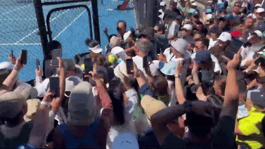 Filipino tennis player Alexandra Eala is swarmed by fans after her practice session.
