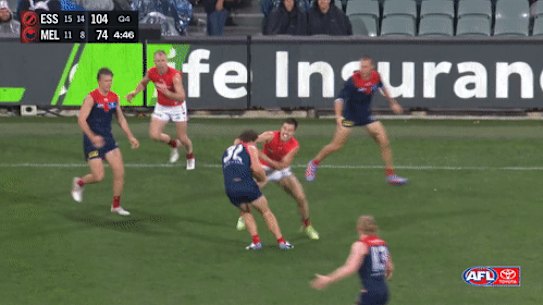 Essendon’s Zach Merrett was banned for one match for this tackle.