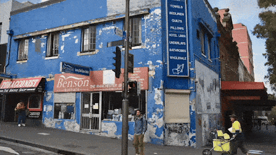 An artist’s impression of a proposed 24 hour McDonald’s restaurant in Redfern and the site as it stands.