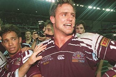 Billy Moore celebrates a win with Maroons teammates in 1995.